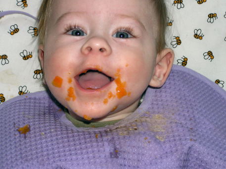 Andres at 6 months "enjoying" Carrot puree